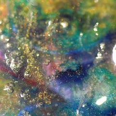 Shiny green blue yellow extremely detailed painting close-up with bubbles