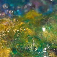 Shiny yellow green blue extremely detailed painting close-up with bubbles