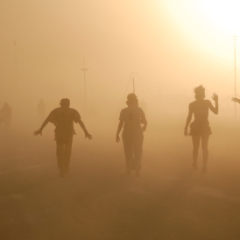 Four people in the dust