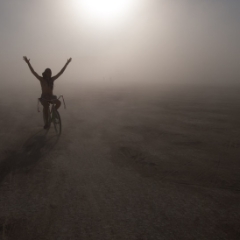 One lone biker in the dust