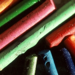 Old peeled crayons closeup