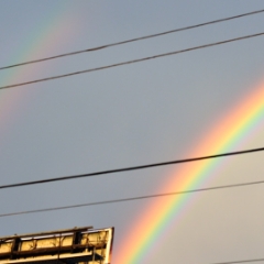 Double rainbow over a billboard