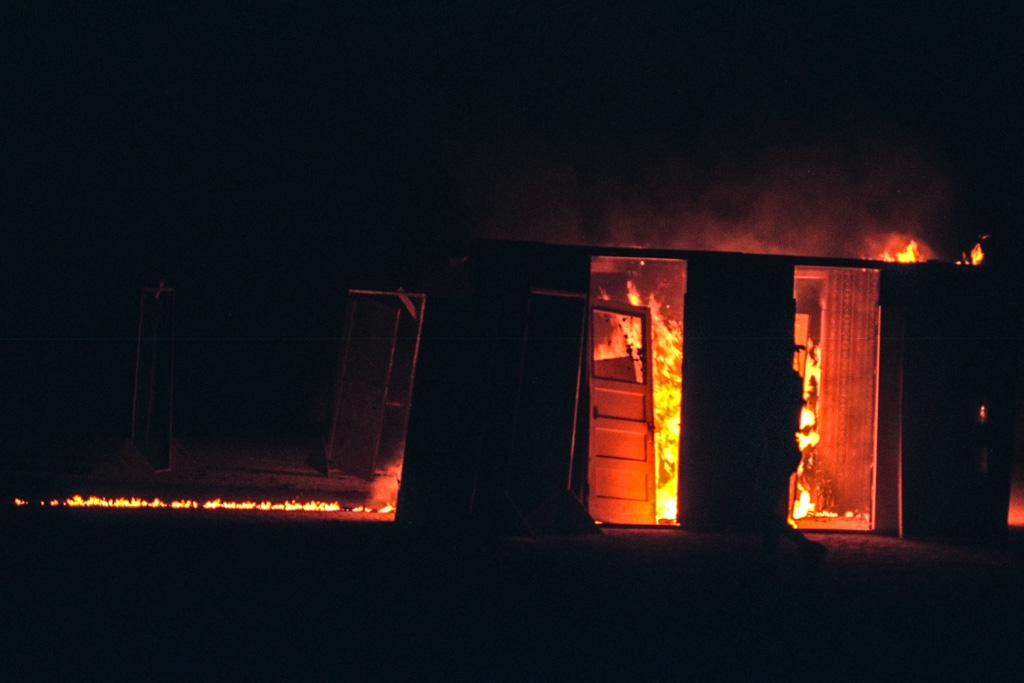 Burning Man 1996 photograph. I remember this art piece before it burned. You could walk through the doors and see reflected surfaces.