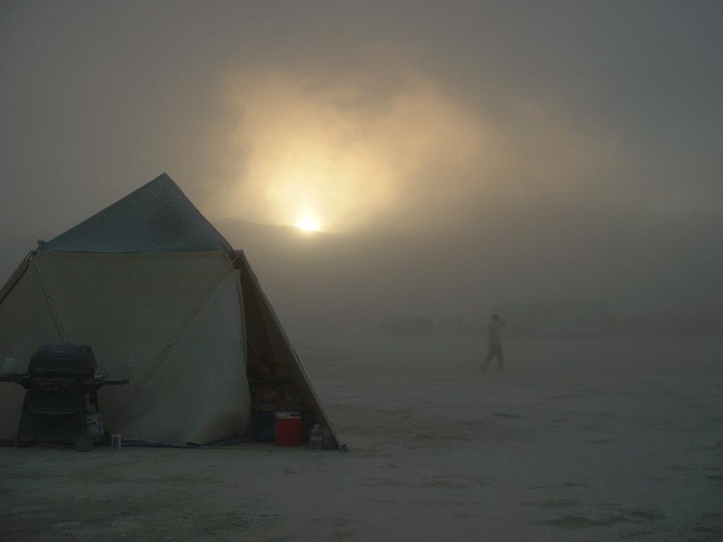 Burning Man 2003 photograph. The kitchen tent, with sunset through the dust. There were frequent white-outs every year at Burning Man.