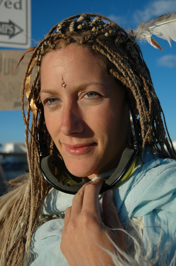 Burning Man 2004 photograph. I like her braids. The lighting was really good for this photo, also. 