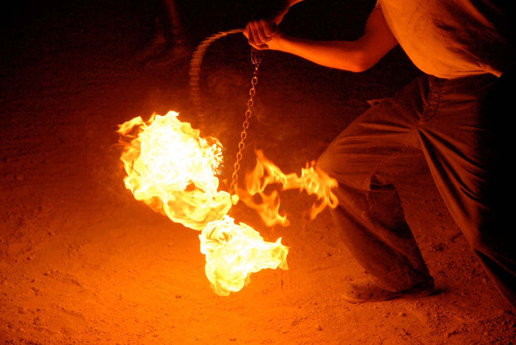 Burning Man 2006 photograph. See <a href='/photos/fire-and-burningman/firespinners/'>the complete firespinner photo gallery</a> for more photos.