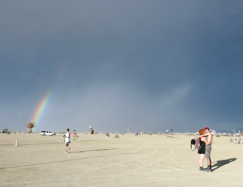 Burning Man 2007 photograph. Some pals of mine smooching under the rainbow. 