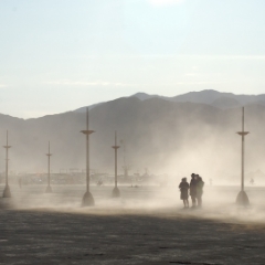 Three people in the dust