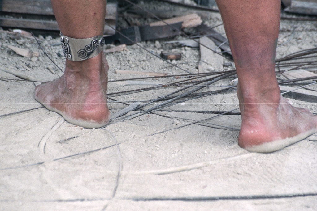 Feet and Shoes photograph. More bare feet in the dust. I like the jewelry around the left ankle.