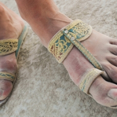 Pretty feet in dusty sandals