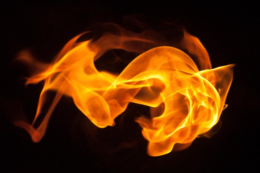 Fire and flames on a black background photograph. 