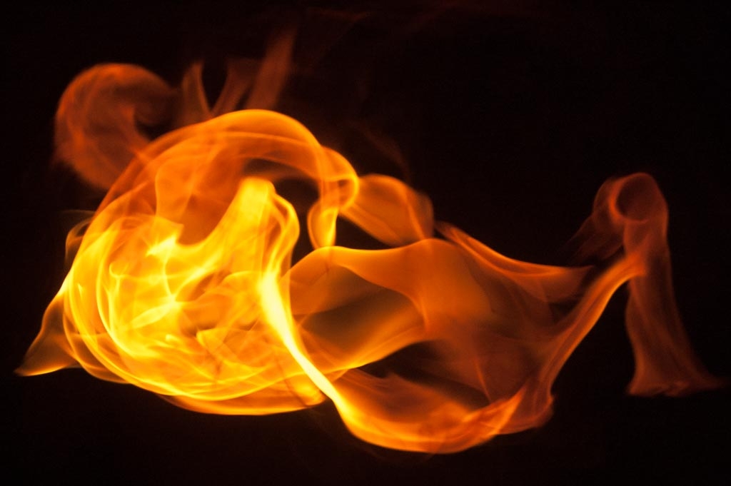 Fire and flames on a black background photograph. 