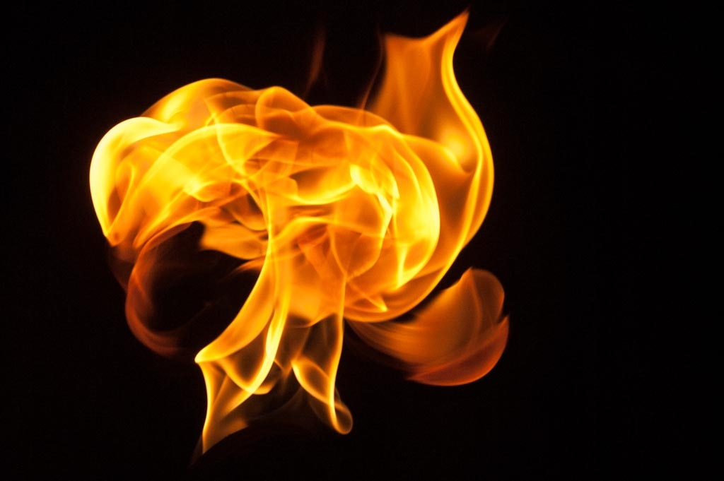 Fire and flames on a black background photograph. 