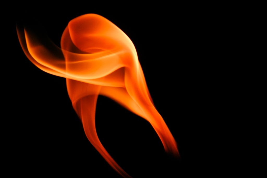 Fire and flames on a black background photograph. 