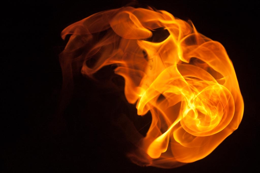 Fire and flames on a black background photograph. 