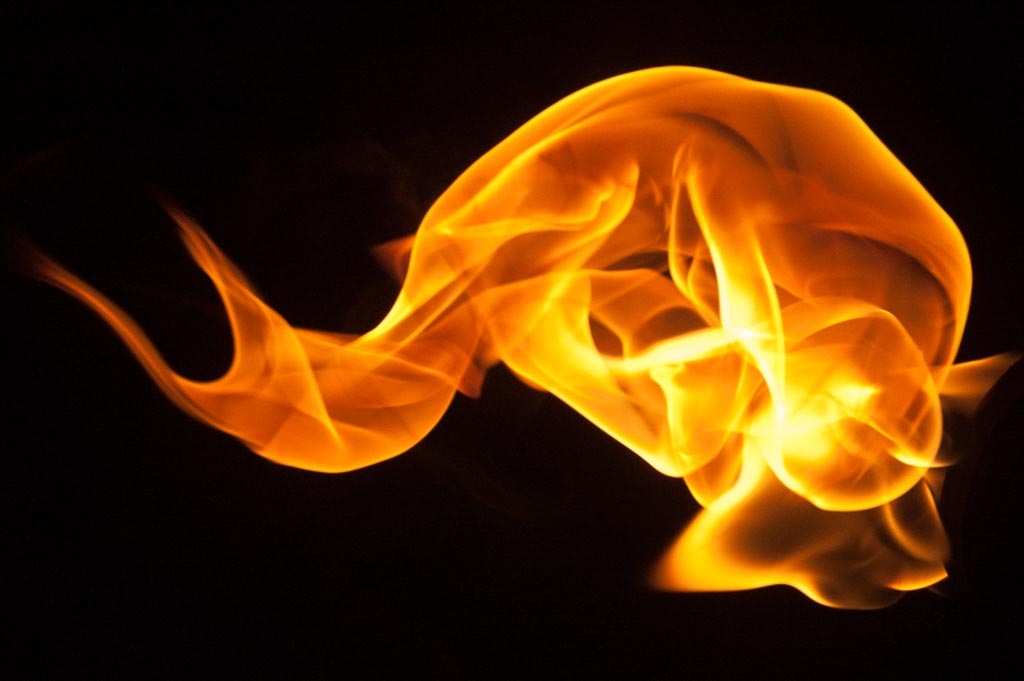 Fire and flames on a black background photograph. 