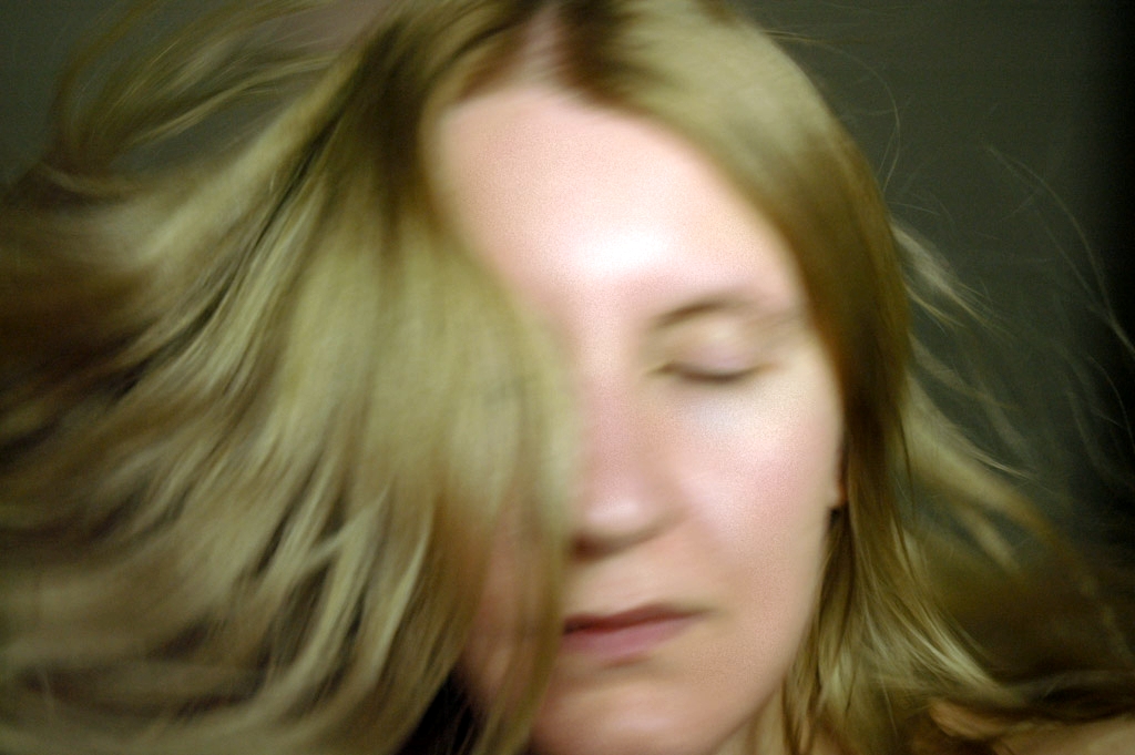 Self portraits photograph. These hair flippy photographs required a lot of light, and a lot of Tylenol.